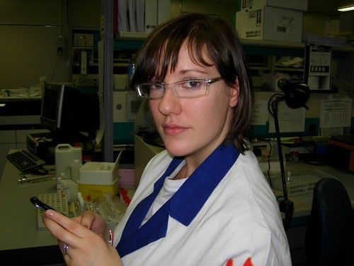 Quality control technician inspecting a formulation sample